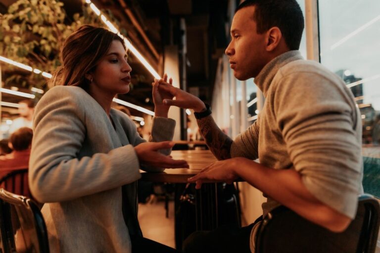 Couple having a conversation at a cafe