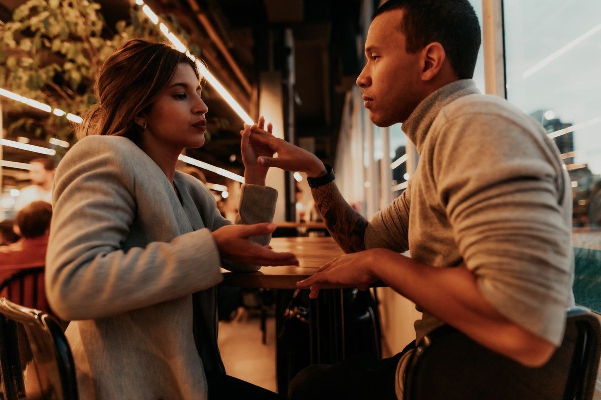 Couple having a conversation at a cafe